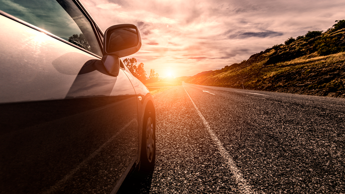 Car and sun light on the road